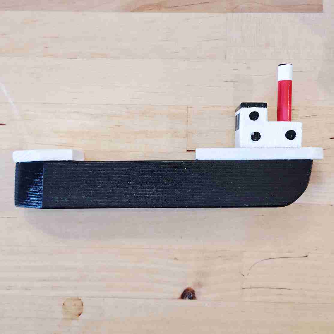 Small black fishing boat by David Fry (COM)