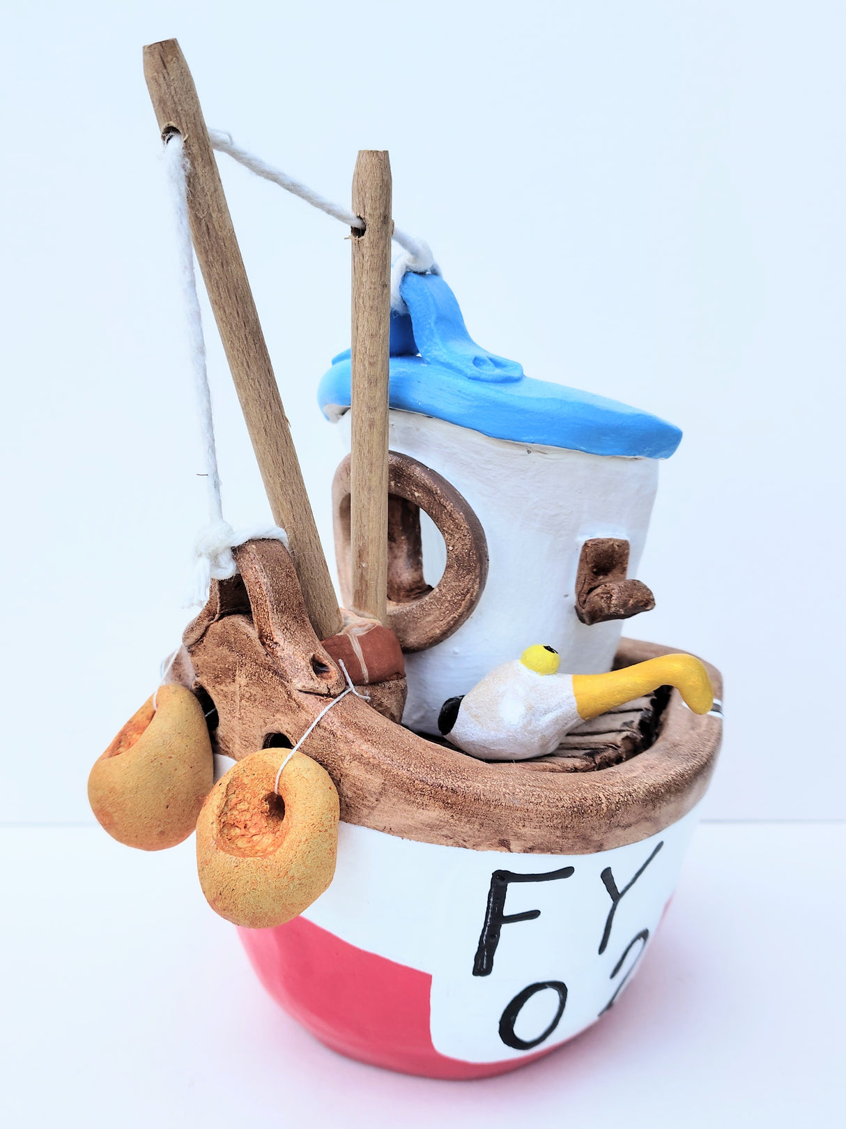 FY02 small red ceramic fishing boat by Louise Thorn
