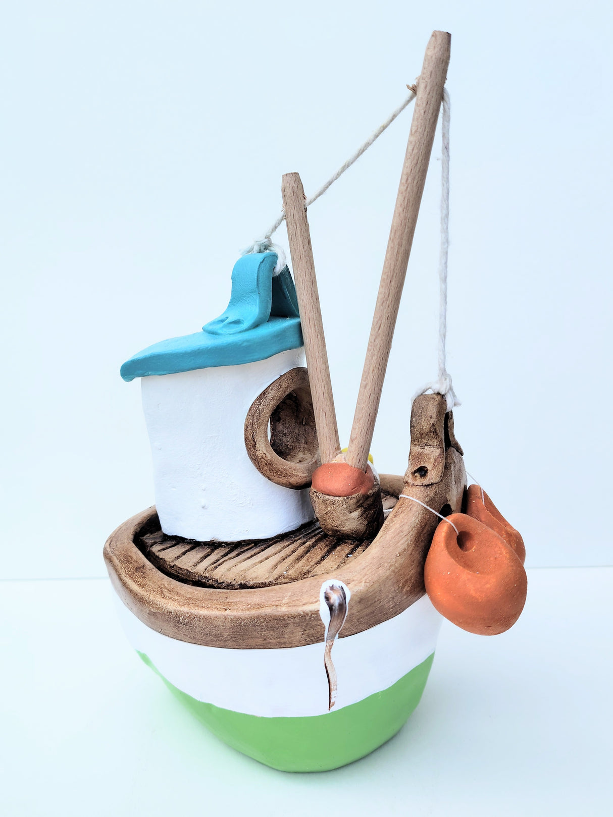 FY04 small green ceramic fishing boat by Louise Thorn