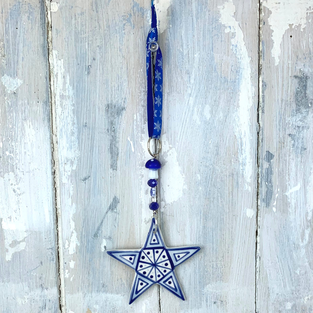 Handmade blue ceramic star Christmas decoration