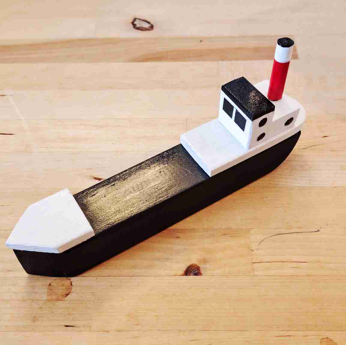 Small black fishing boat by David Fry (COM)