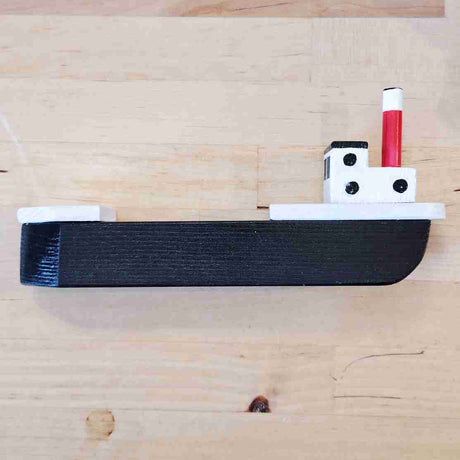 Small black fishing boat by David Fry (COM)