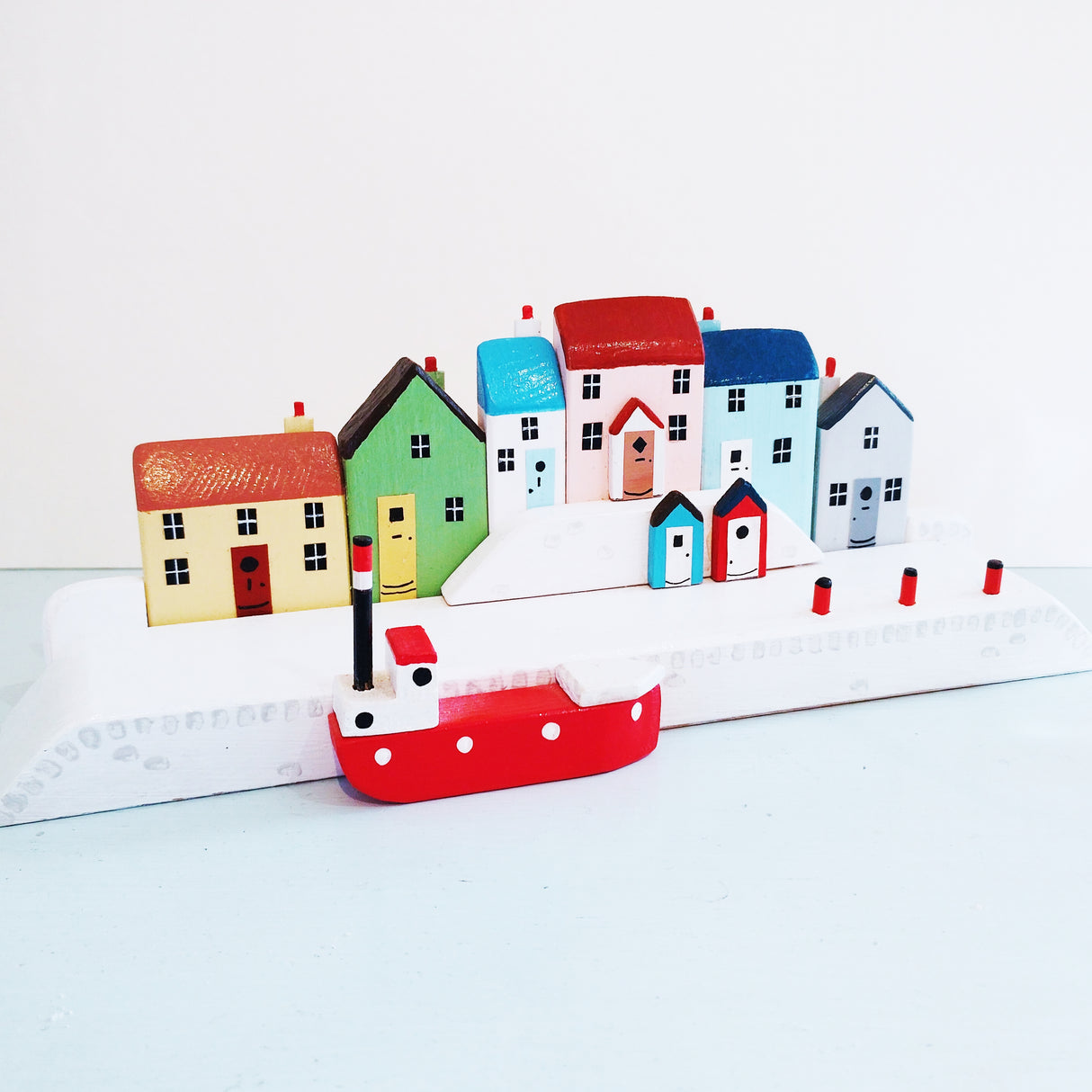 Wooden harbour with a medium red fishing boat by David Fry (COM)