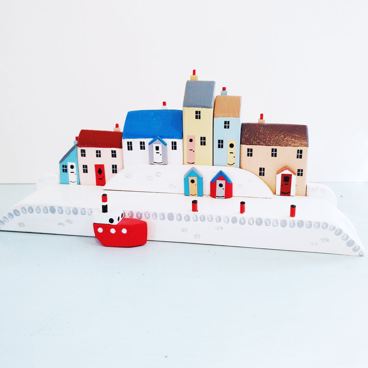 Wooden harbour with a small fishing boat by David Fry (COM)