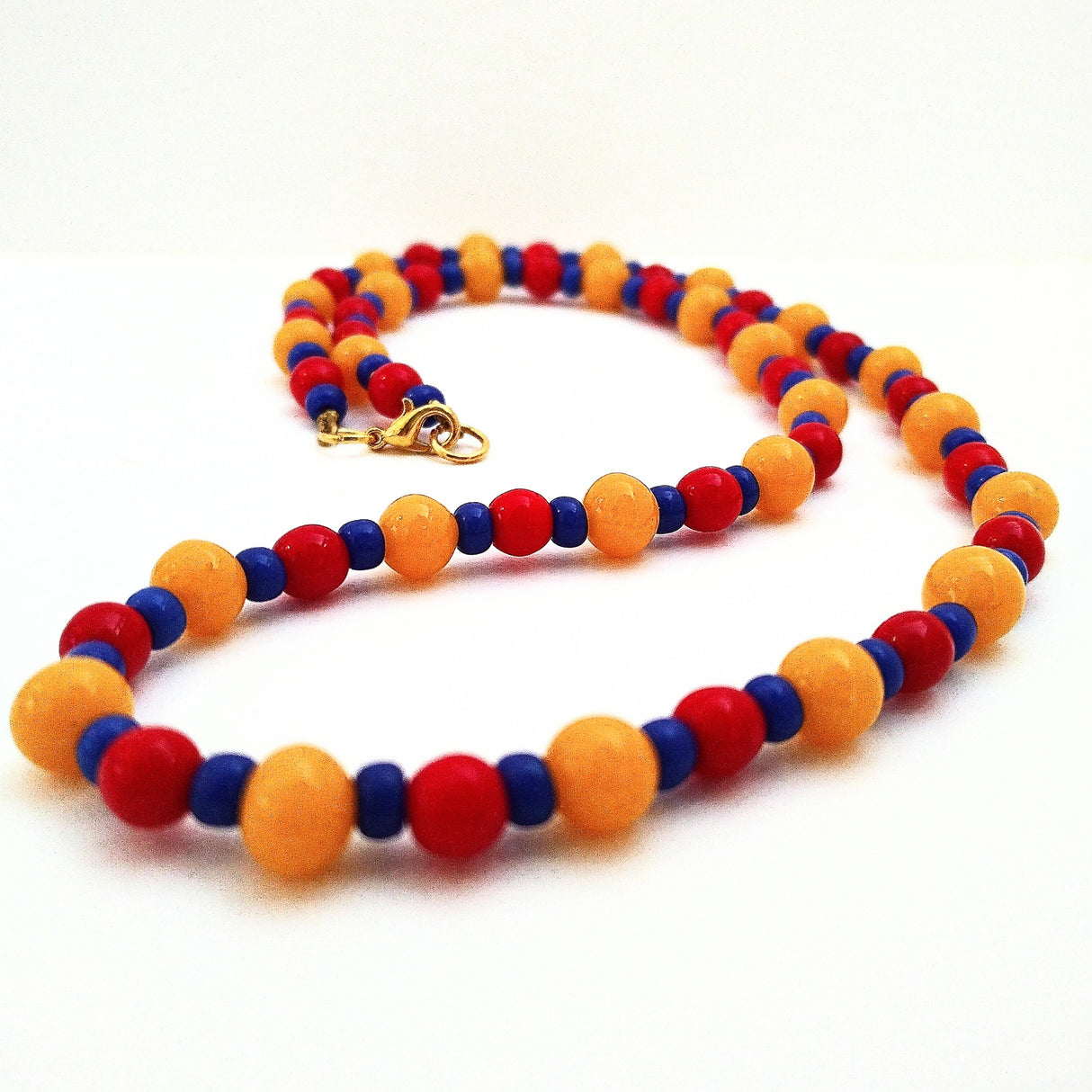 Vintage beads necklace in blue, red & yellow by Margaret Gould (com)