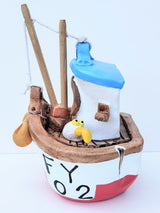 FY02 small red ceramic fishing boat by Louise Thorn