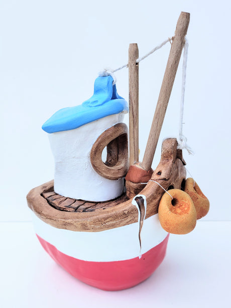 FY02 small red ceramic fishing boat by Louise Thorn