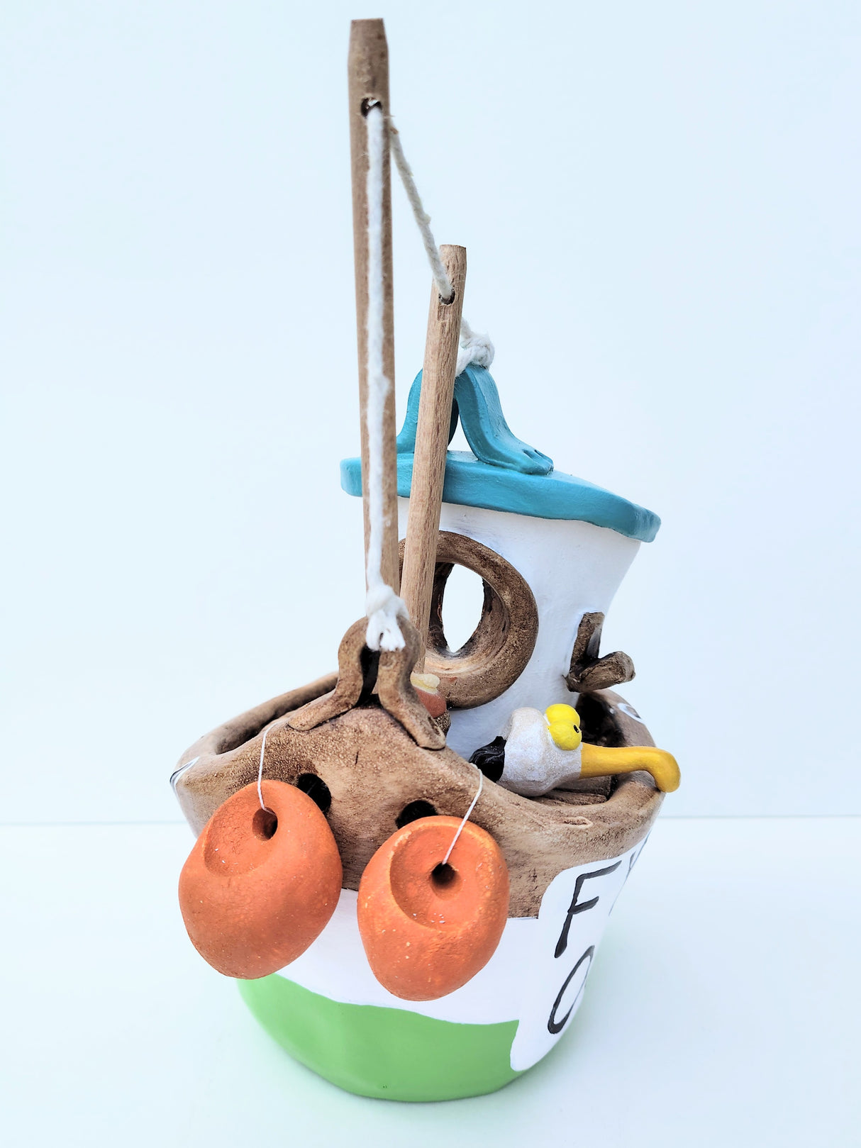 FY04 small green ceramic fishing boat by Louise Thorn