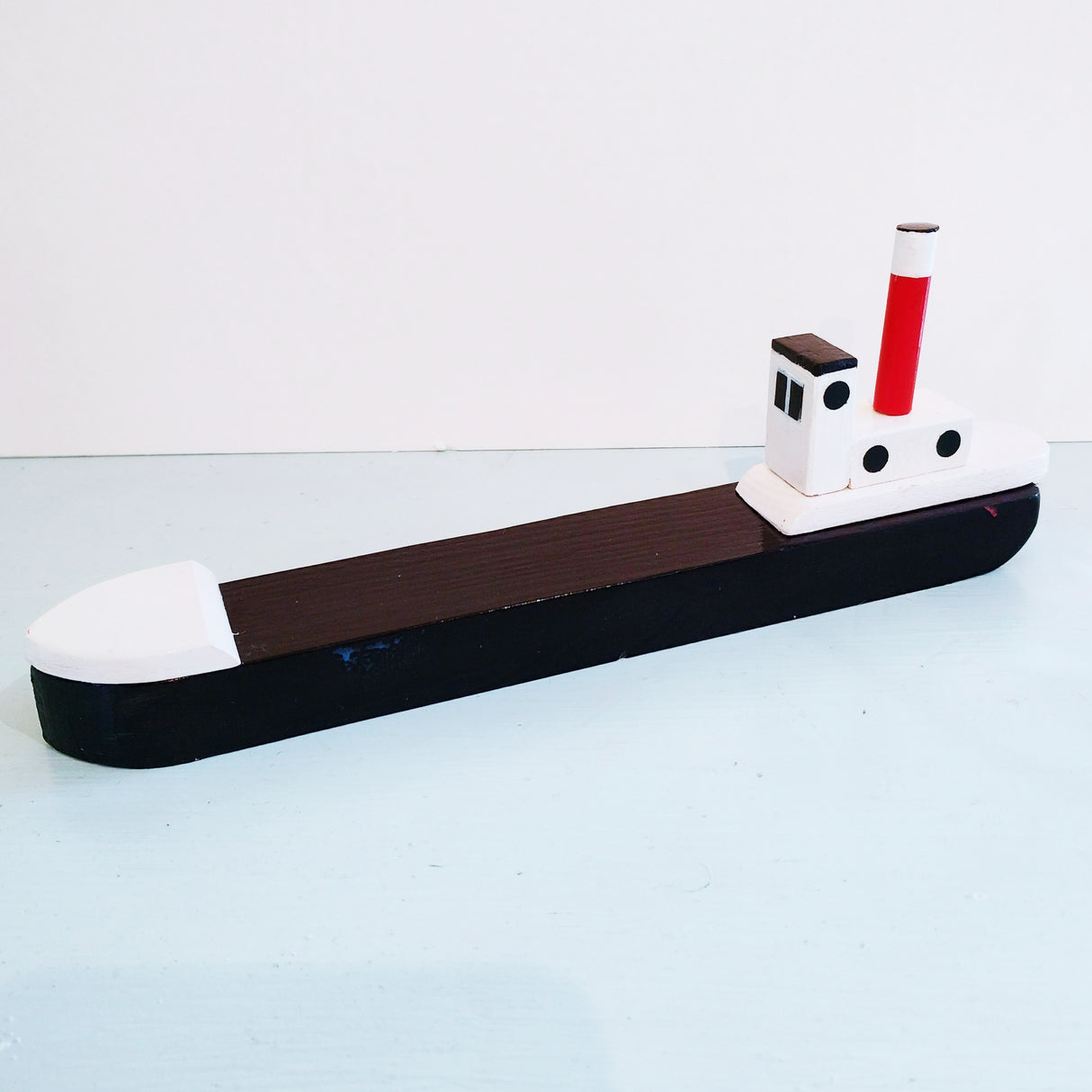 Small black fishing boat by David Fry (COM)