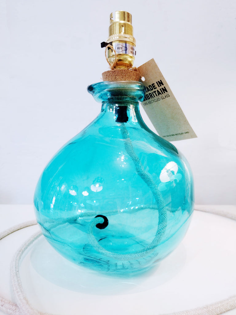 Aqua coloured glass lamp base with cream flex