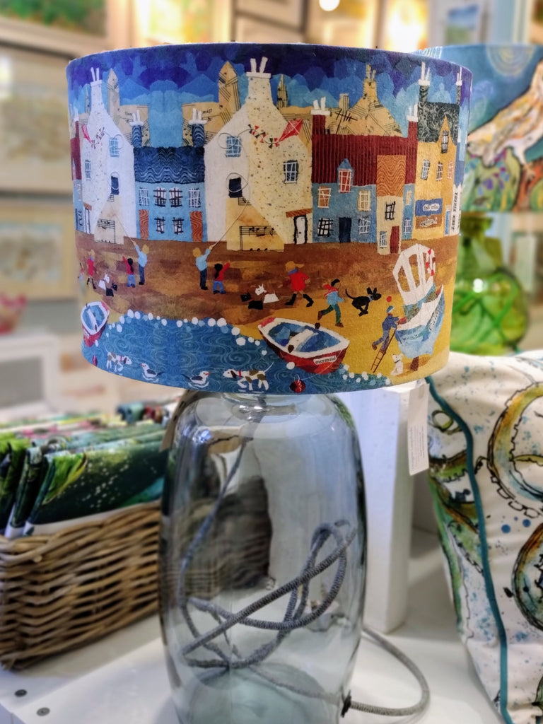 coastal harbour lampshade shown on a glass lamp-base