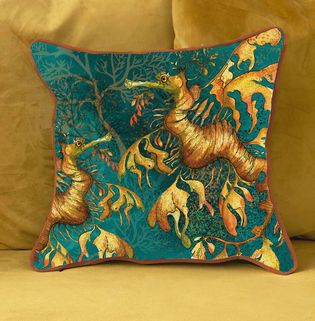 sea-dragon on a teal background cotton cushion with orange piping