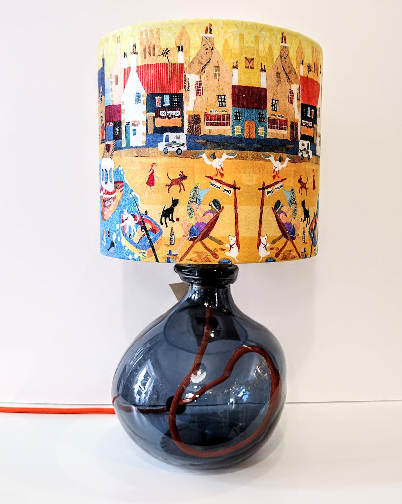 Petrol blue recycled glass lamp-base shown with a coastal lampshade