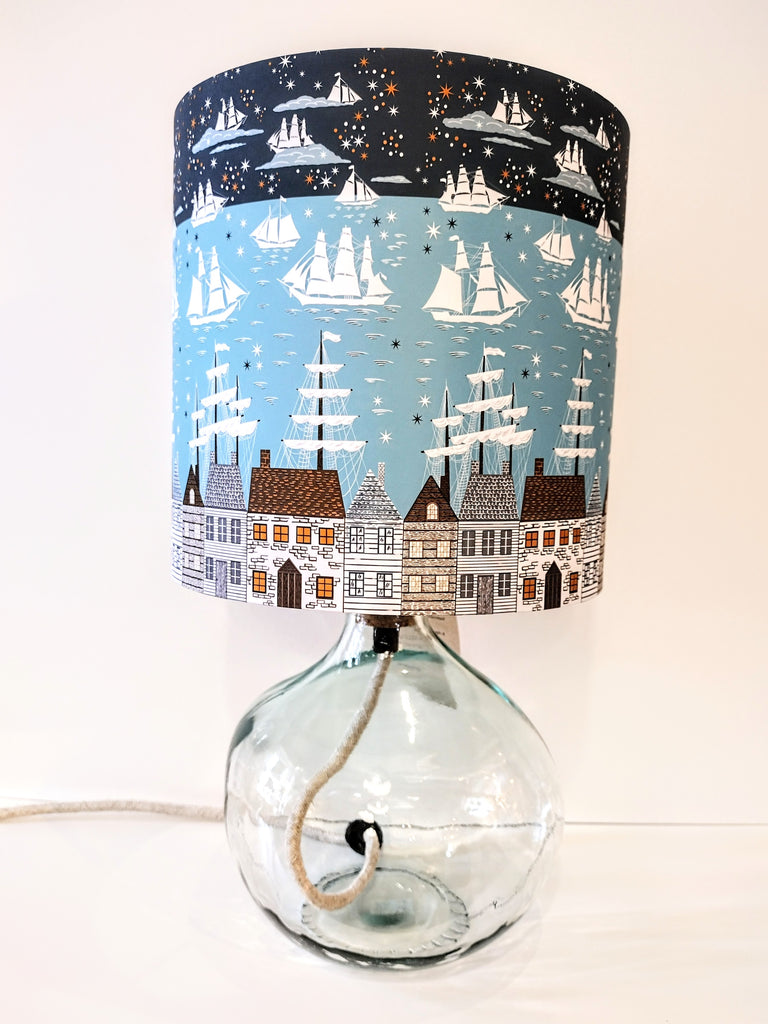 Clear recycled glass lamp-base shown with a passing ships lampshade