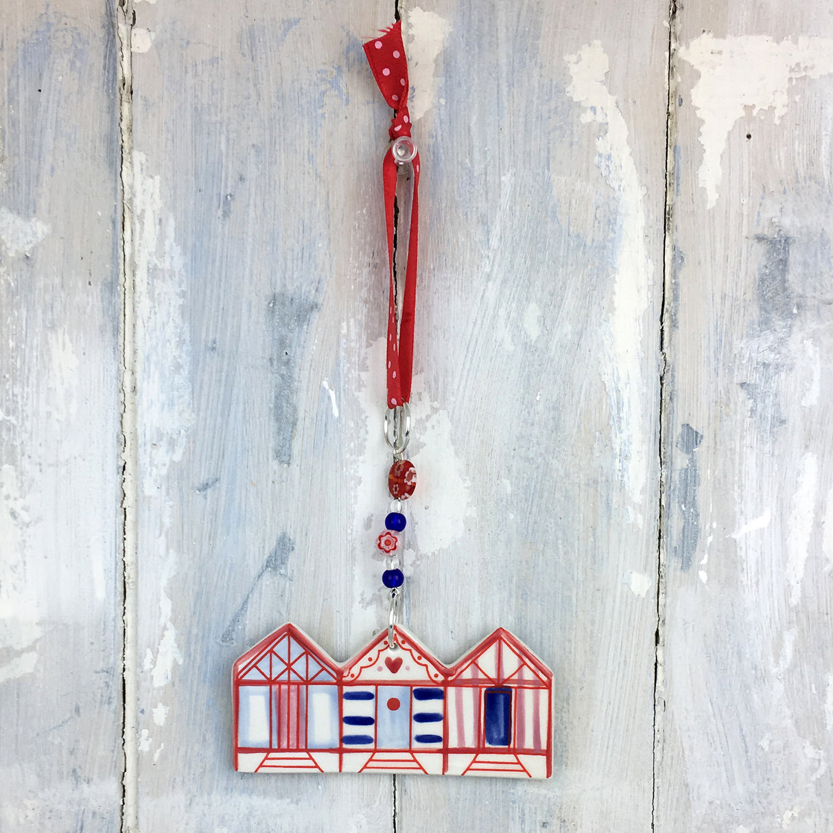 Handmade colourful beach hut decoration