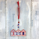 Handmade colourful beach hut decoration